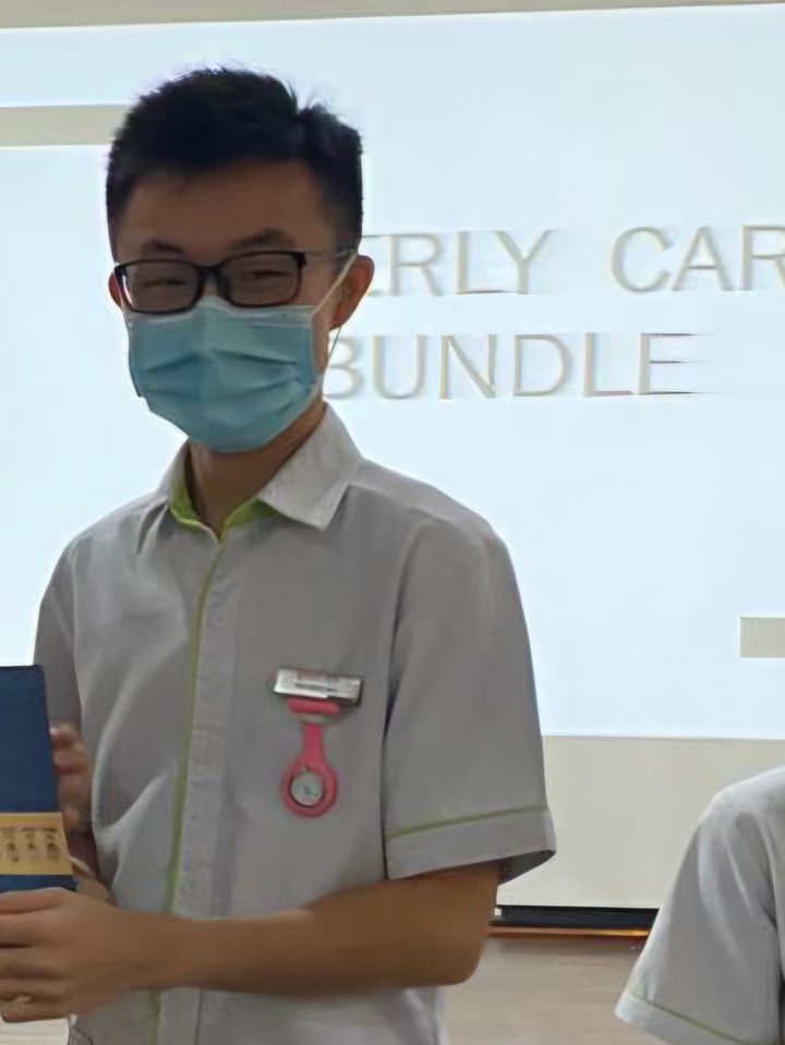 Chuan Long in a student nurse’s uniform and mask